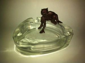 I'm fascinated by the possibilities of Fimo, a bakeable polymer clay that comes in a vast range of colours. This little fellow is an early experiment in adding ornamentation to other objects, whether baked on (as in this case) or baked separately and glued on later.